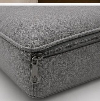 Close-up of the Cradle pillow's zipper on its removable, washable cover